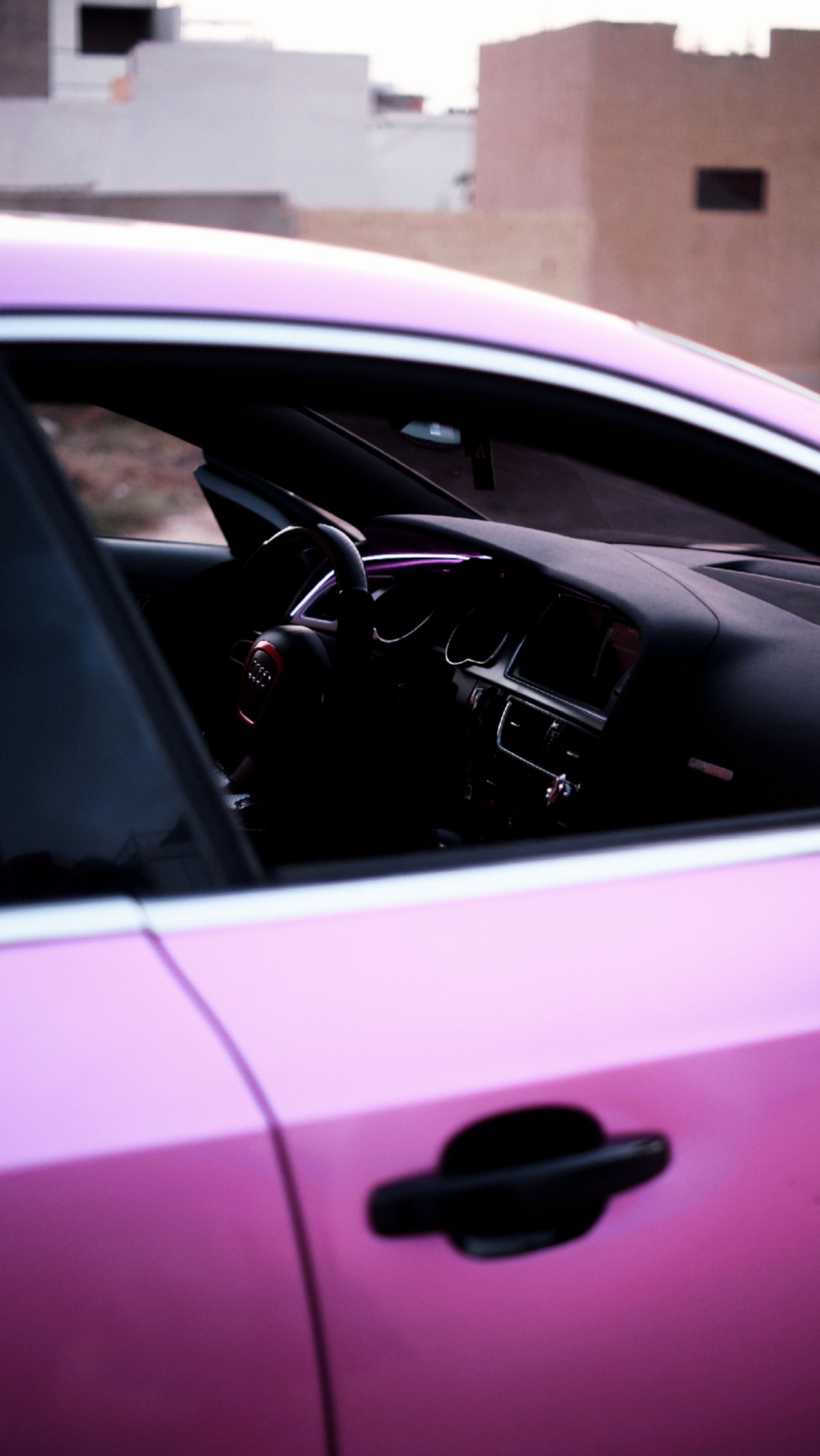 Pink Audi RS5 interior through window