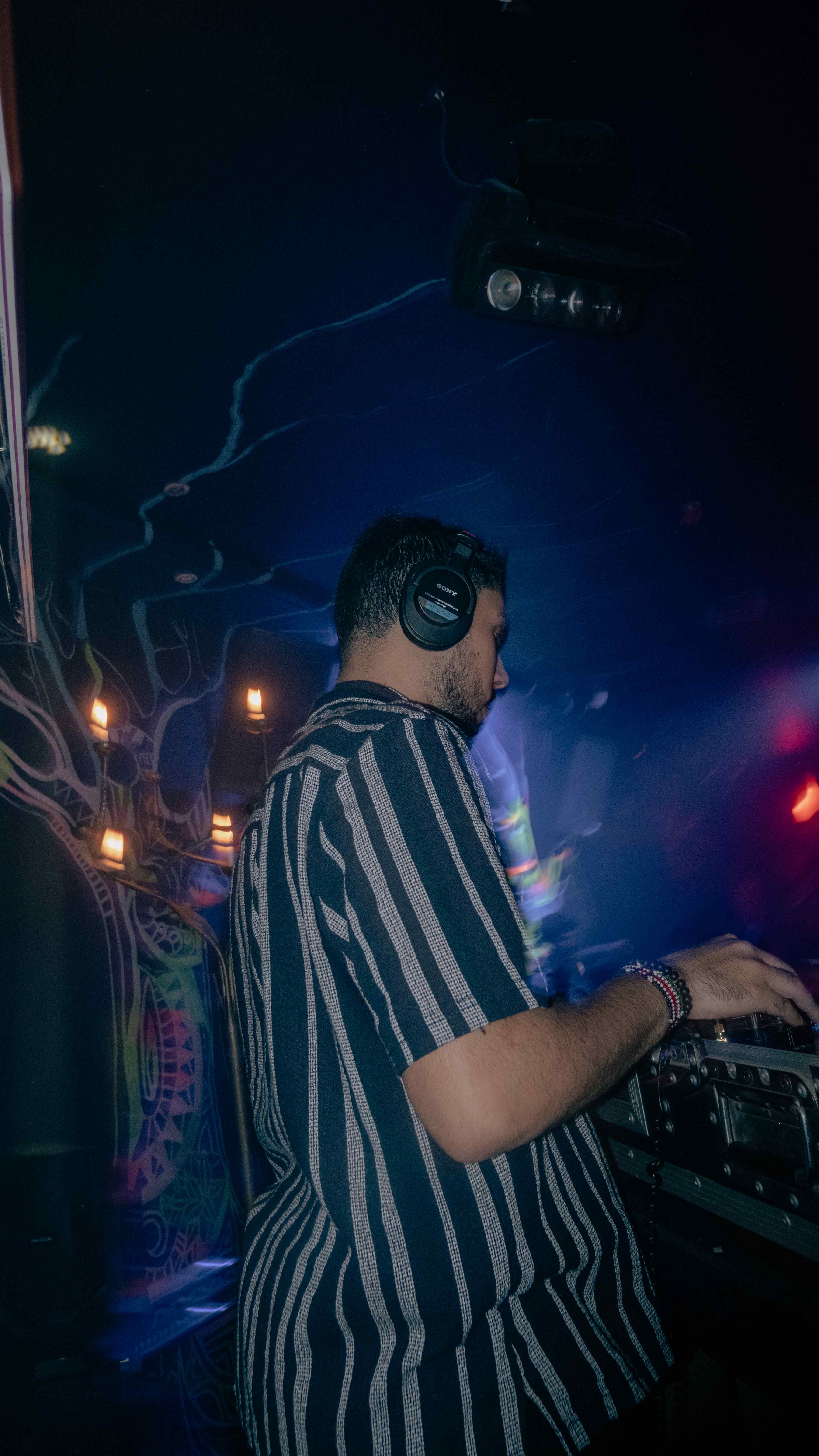 DJ performing with atmospheric lighting