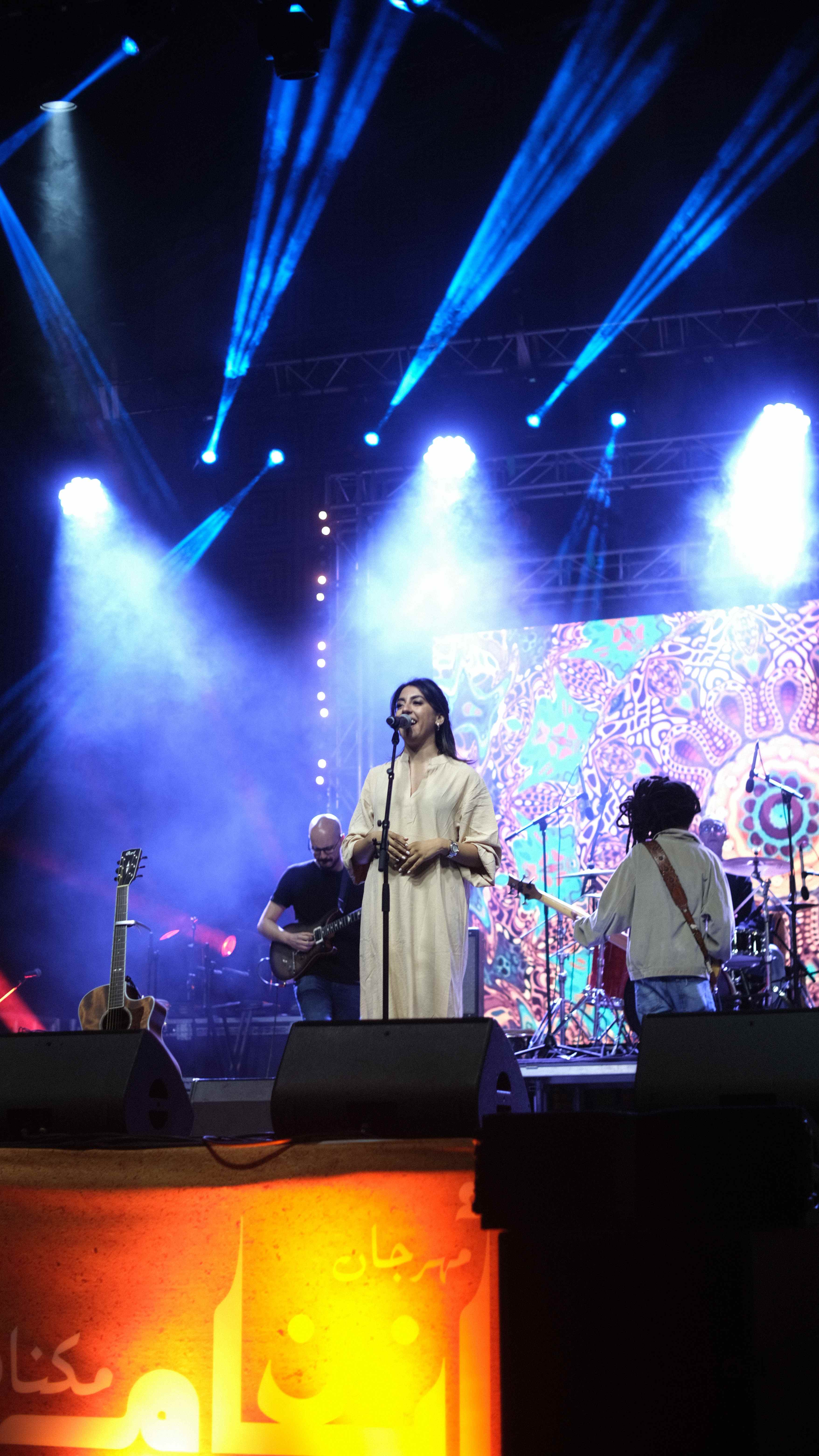 Live concert performance with blue stage lighting