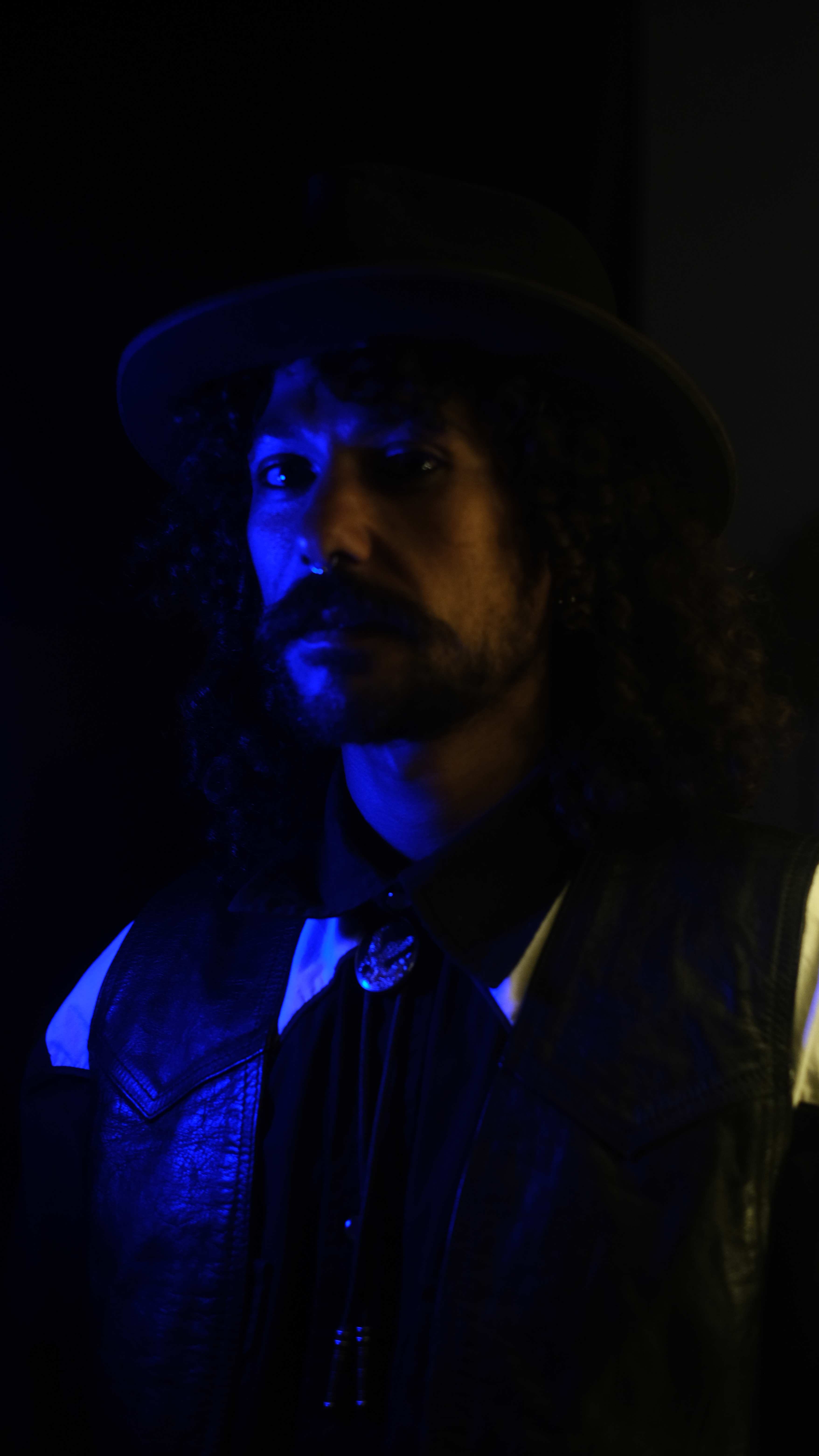 Creative portrait with blue lighting