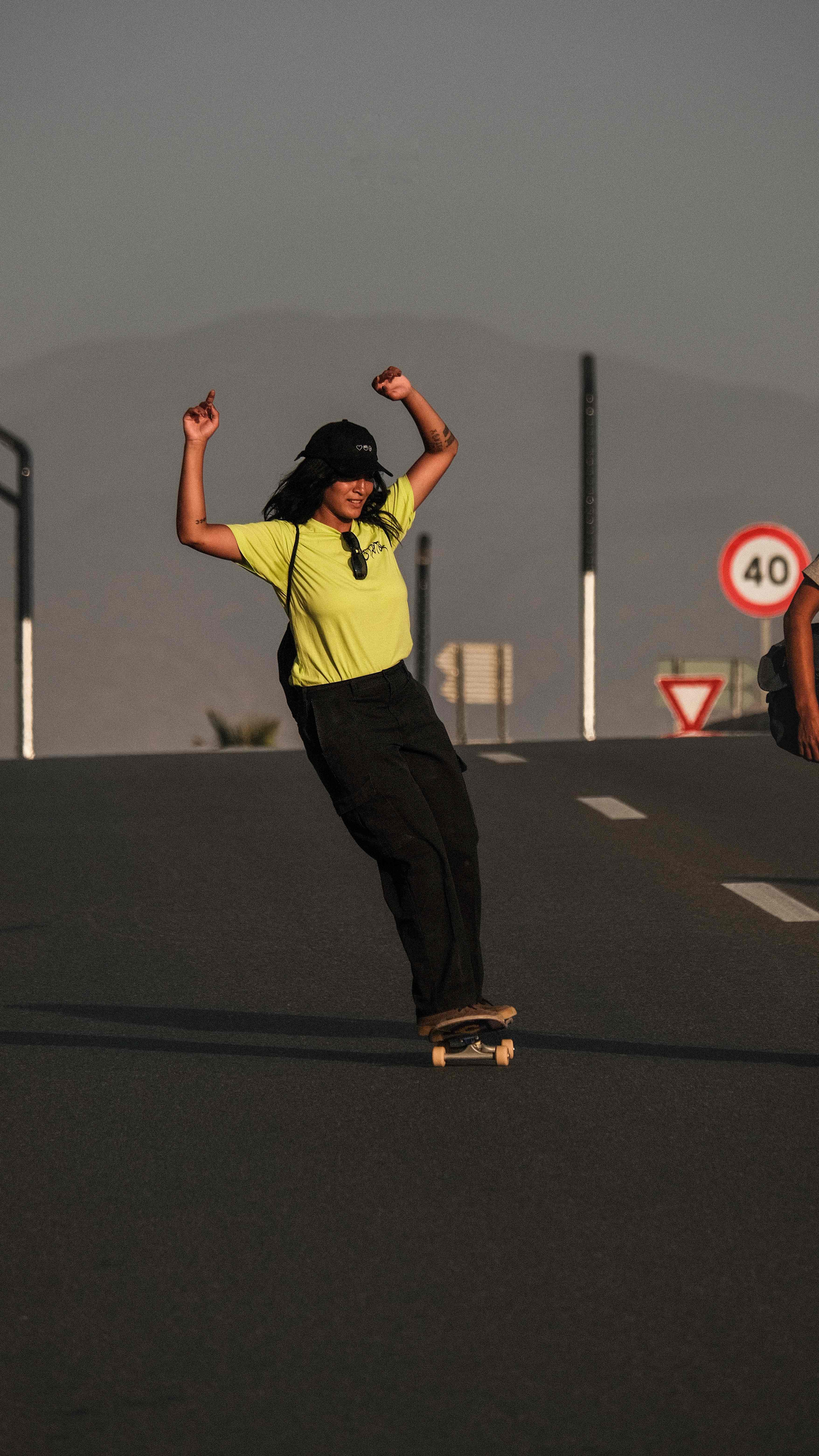Street skateboarding with celebration pose