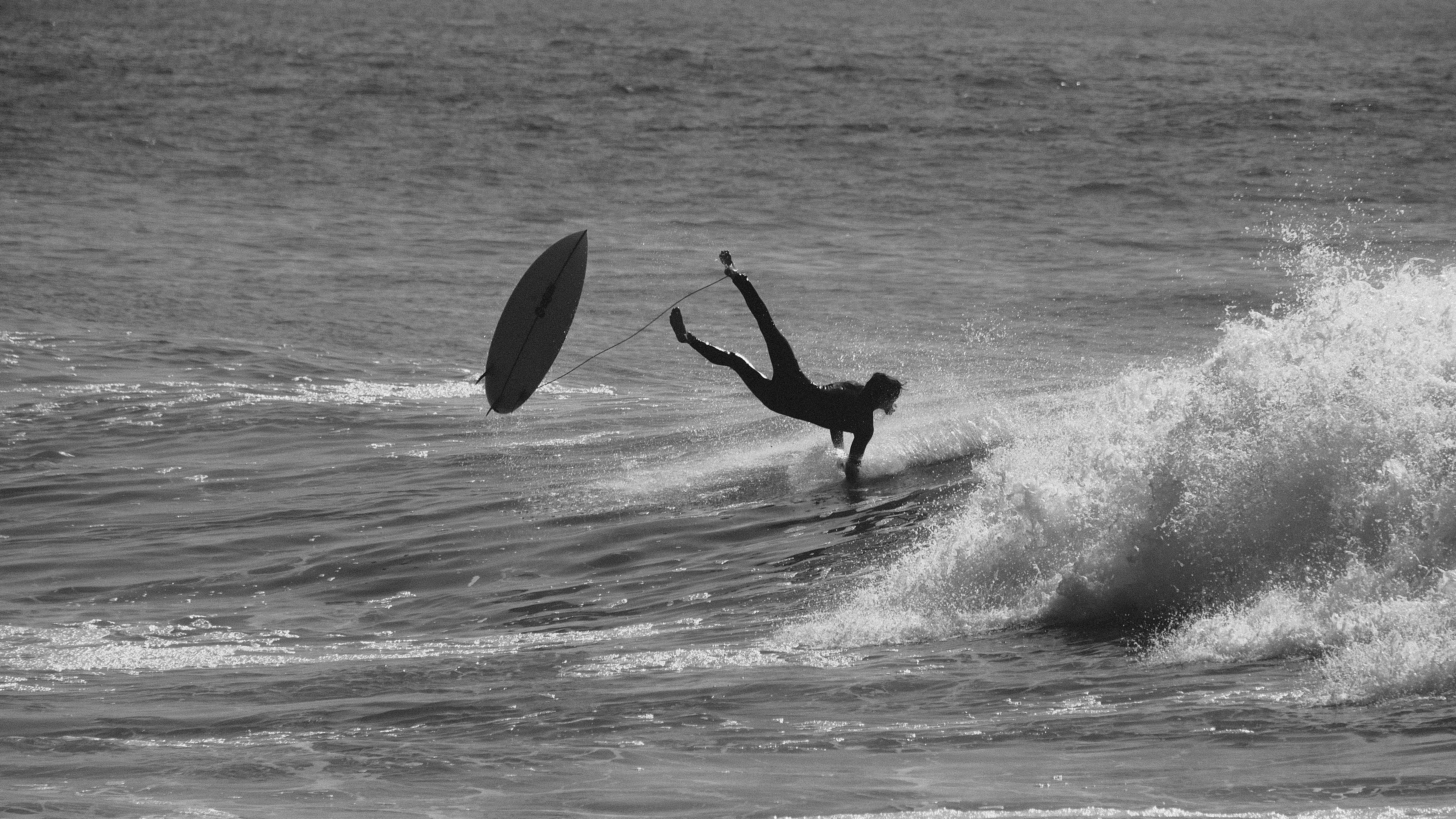 Dramatic black and white surf wipeout